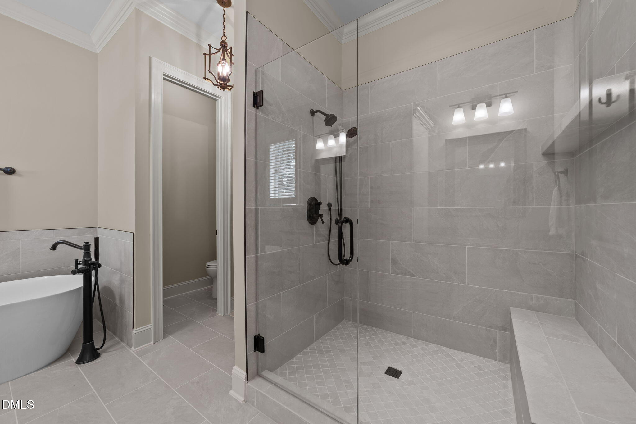 1859 Versa Court Apex, NC 27502 - Photo 17 of 46 a bathroom with a shower and a bathtub