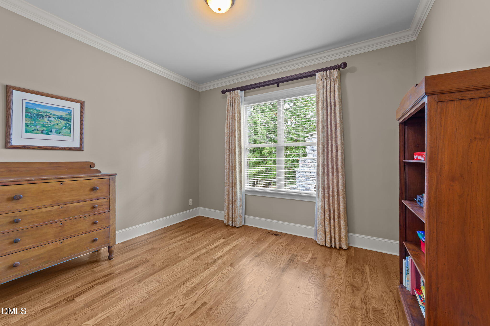 1859 Versa Court Apex, NC 27502 - Photo 19 of 46 a view of room with window and wooden floor