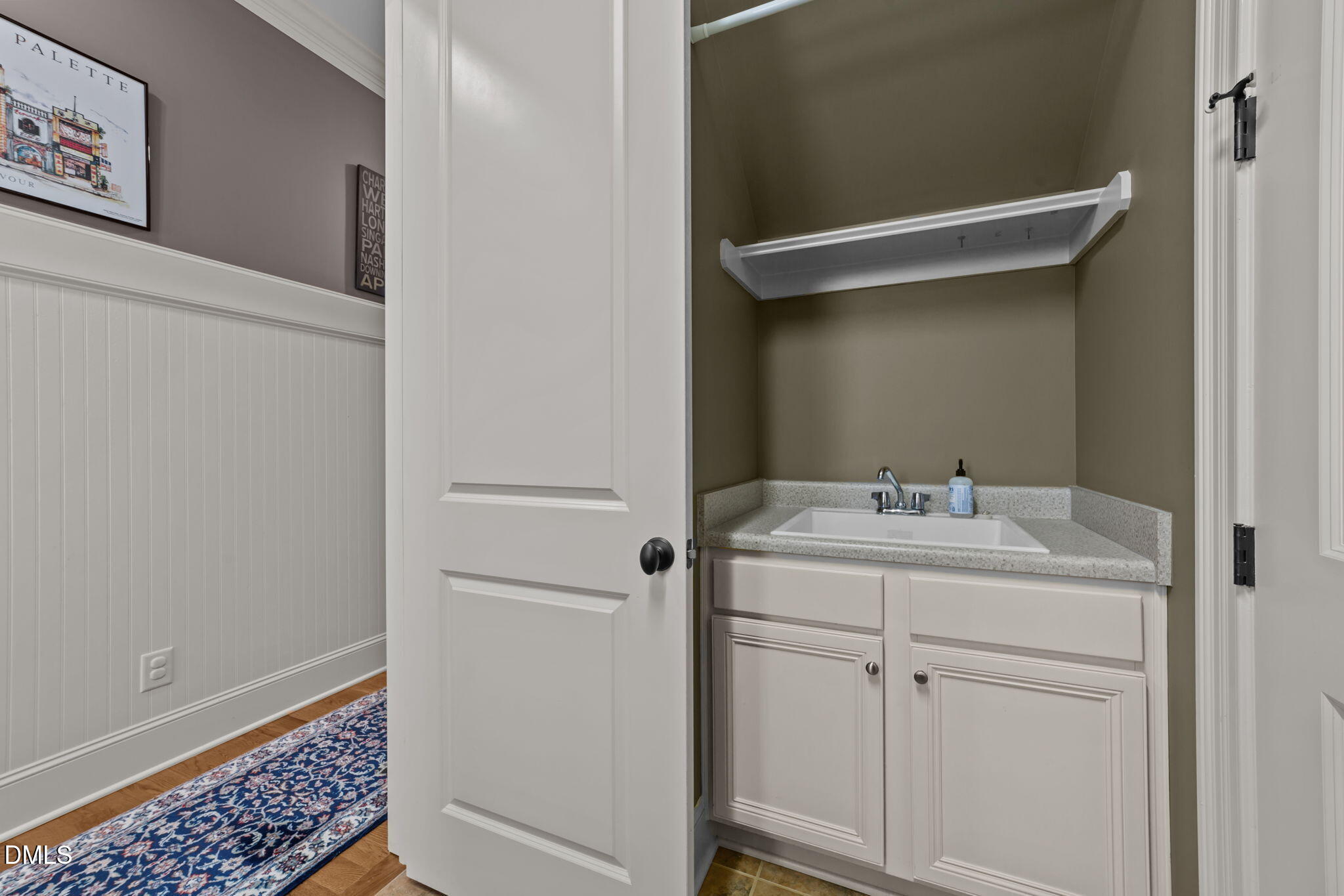 1859 Versa Court Apex, NC 27502 - Photo 23 of 46 a bathroom with a sink and mirror