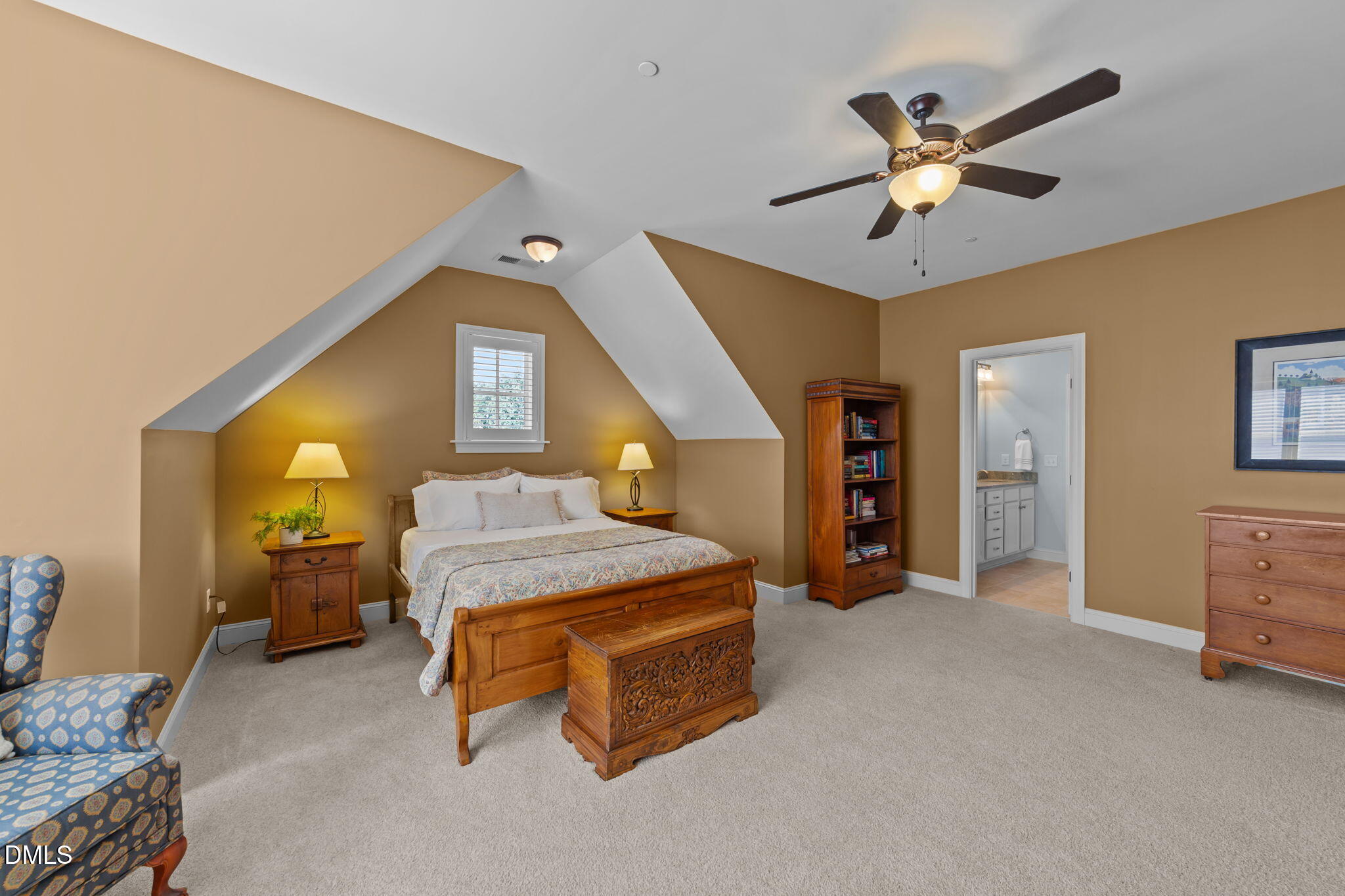 1859 Versa Court Apex, NC 27502 - Photo 26 of 46 a bedroom with a bed and a chandelier