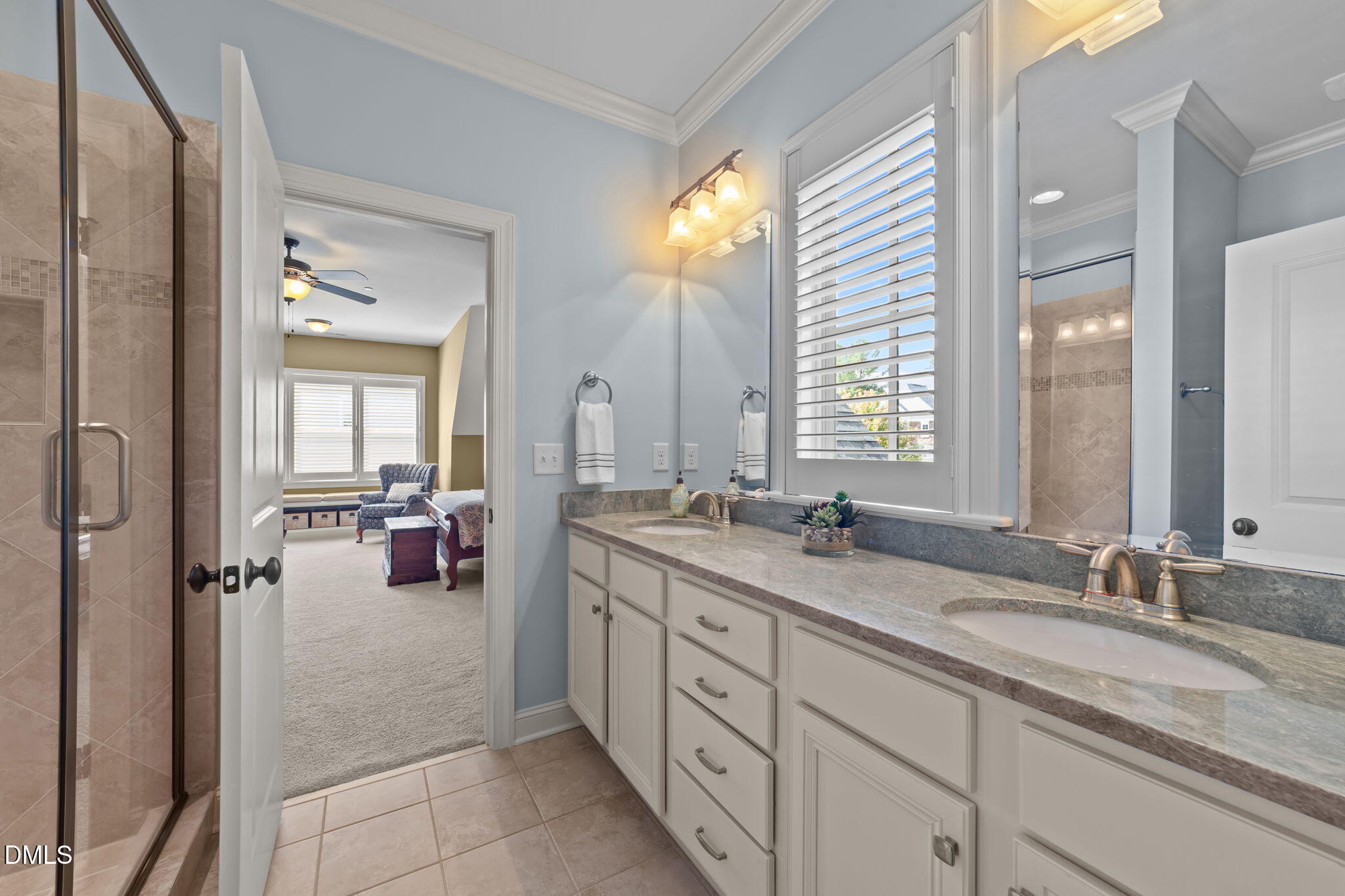 1859 Versa Court Apex, NC 27502 - Photo 28 of 46 a spacious bathroom with a granite countertop sink mirror and double