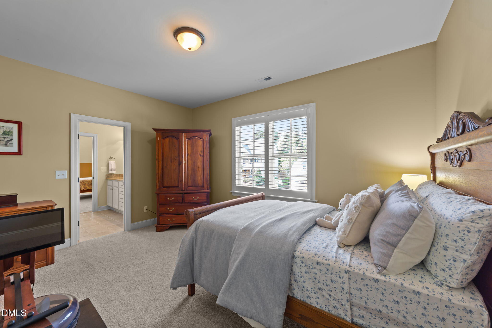 1859 Versa Court Apex, NC 27502 - Photo 30 of 46 a bedroom with a bed and a closet