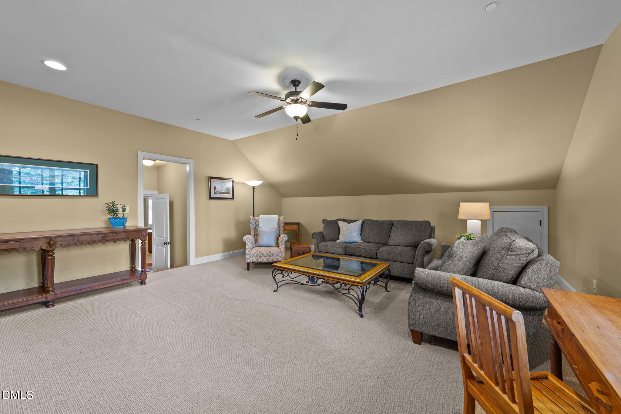 1859 Versa Court Apex, NC 27502 - Photo 31 of 46 a living room with furniture and a ceiling fan