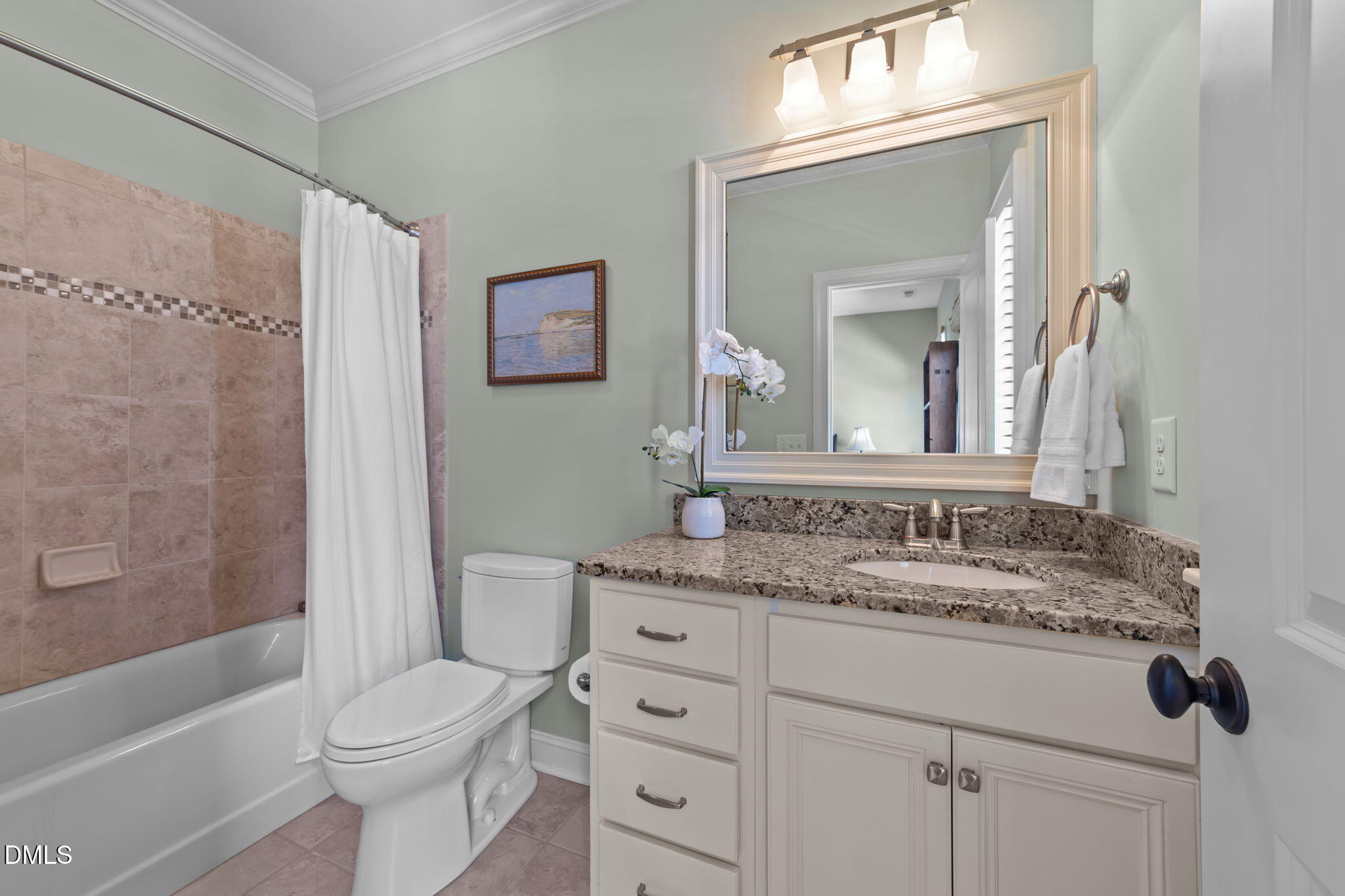 1859 Versa Court Apex, NC 27502 - Photo 35 of 46 a bathroom with a granite countertop sink toilet and shower