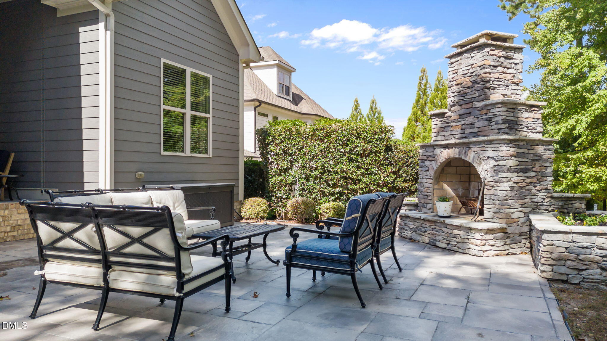 1859 Versa Court Apex, NC 27502 - Photo 39 of 46 a view of a chairs and table in the back yard of the house