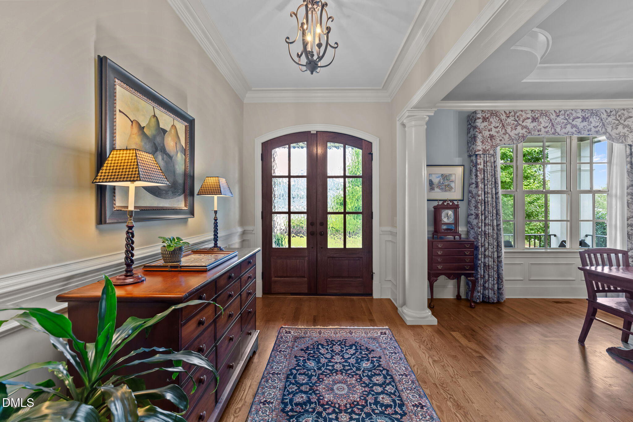 1859 Versa Court Apex, NC 27502 - Photo 4 of 46 a hallway with a large window and wooden floor