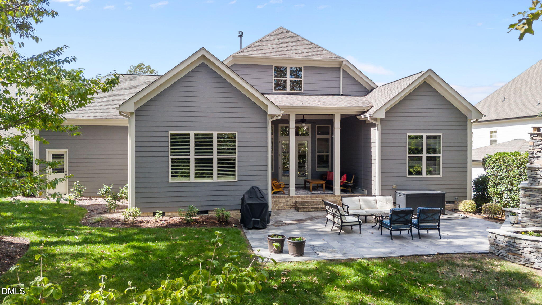 1859 Versa Court Apex, NC 27502 - Photo 42 of 46 a front view of house with yard and outdoor seating