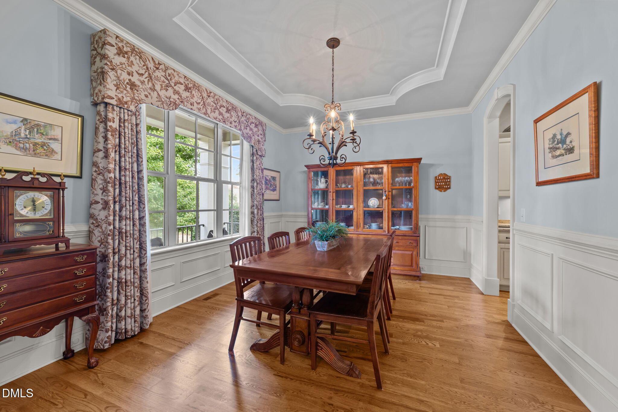 1859 Versa Court Apex, NC 27502 - Photo 5 of 46 a view of a dining room with furniture window and wooden floor
