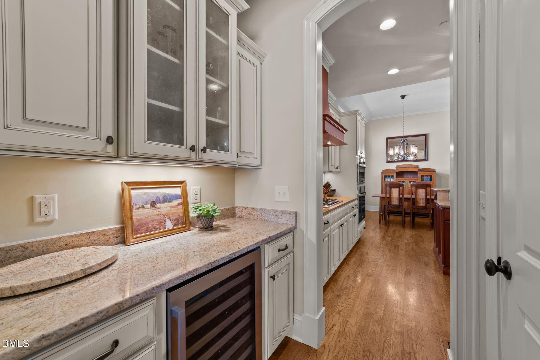 1859 Versa Court Apex, NC 27502 - Photo 6 of 46 a kitchen with granite countertop a sink stove and cabinets