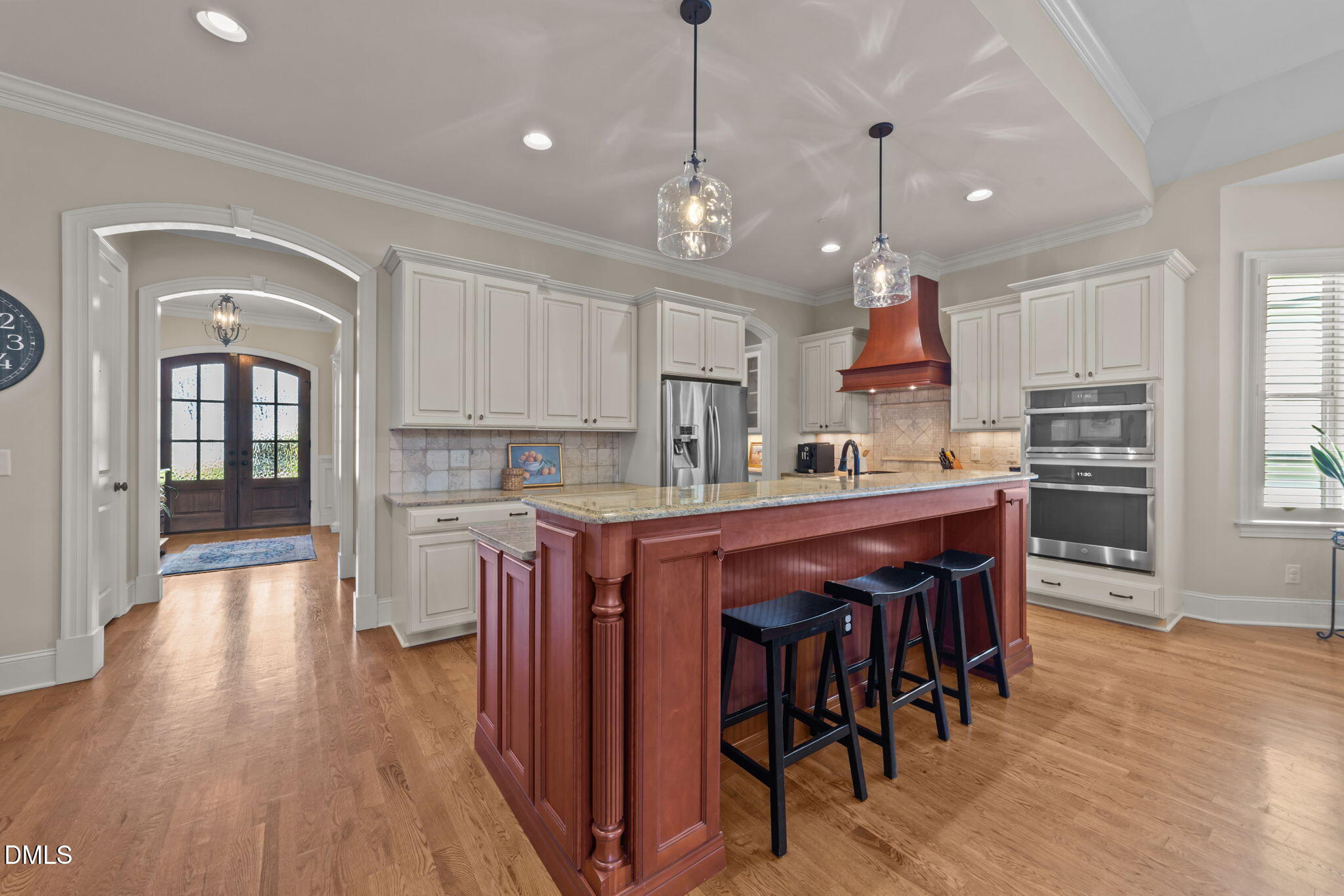 1859 Versa Court Apex, NC 27502 - Photo 7 of 46 a kitchen with stainless steel appliances granite countertop a refrigerator a stove a sink dishwasher and a dining table with wooden floor