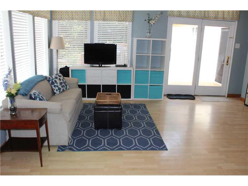 Living Room. Living room/ Dining room combo surrounded by windows with a door to the deck!