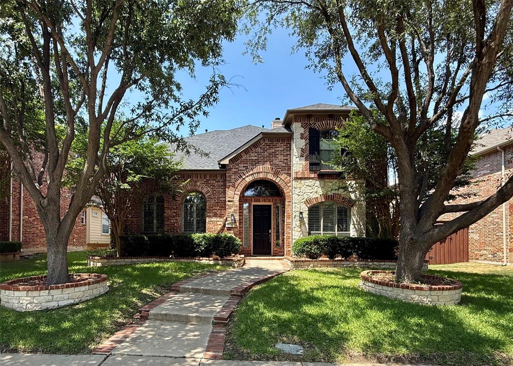 2754 Ridge View Road Frisco, TX 75034 - Photo 2 of 34 a front view of a house with garden