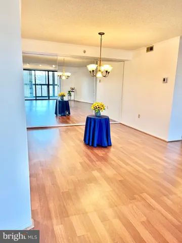 a view of a room with a ceiling fan