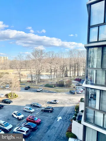 a front view of a building with parking space