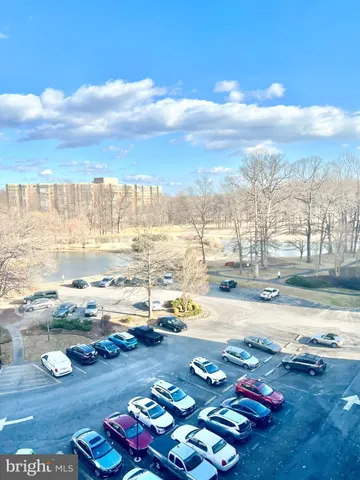 a car parked in front of a tall building