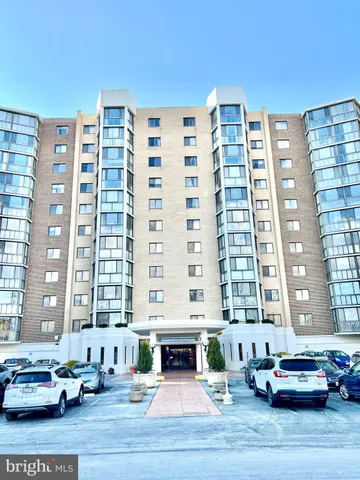 a view of a house with swimming pool and sitting area