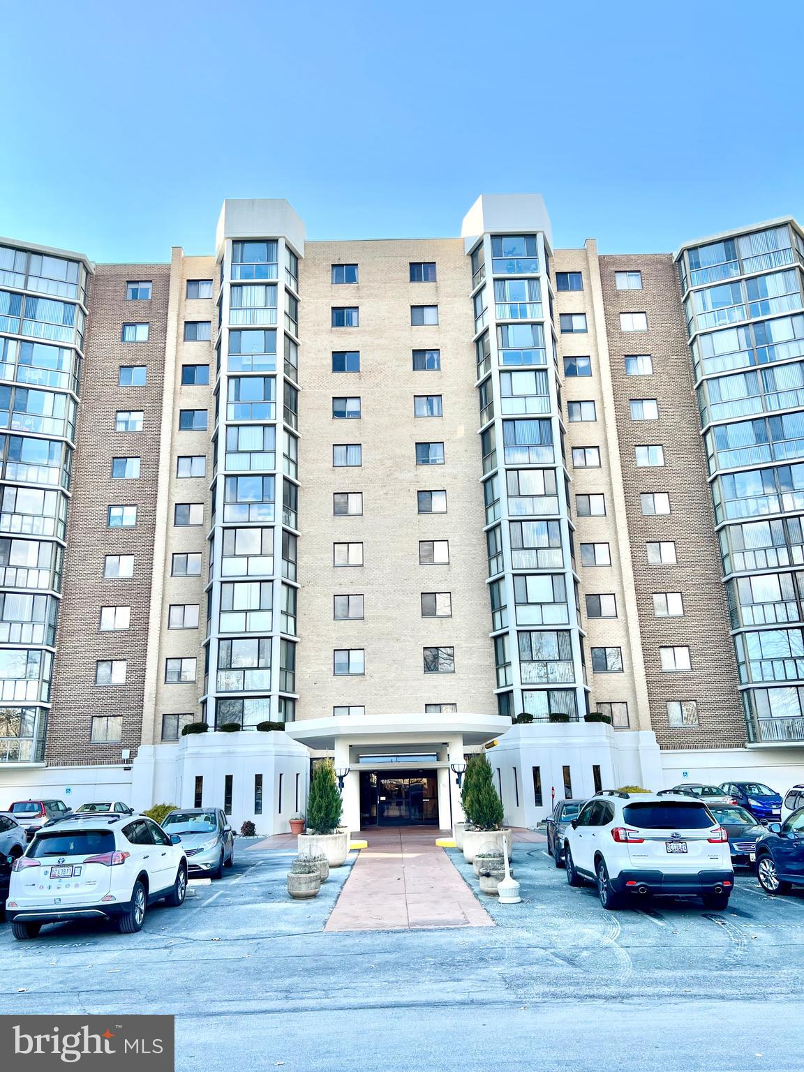 15115 Interlachen Drive, Unit 3603 Silver Spring, MD 20906 - Photo 28 of 49 a front view of a building with parking space