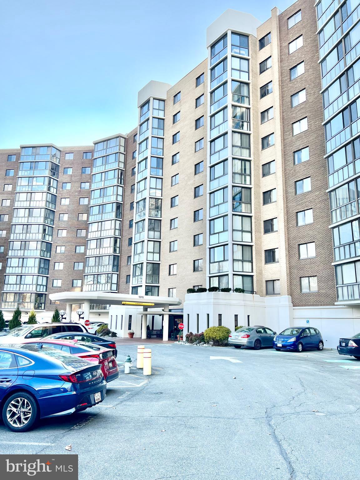 15115 Interlachen Drive, Unit 3603 Silver Spring, MD 20906 - Photo 29 of 49 a car parked in front of a tall building