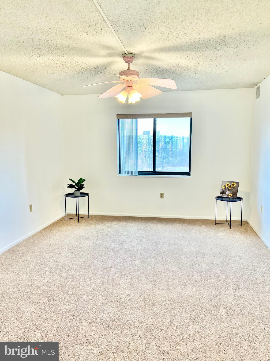 15115 Interlachen Drive, Unit 3603 Silver Spring, MD 20906 - Photo 4 of 49 a view of a livingroom with a staircase