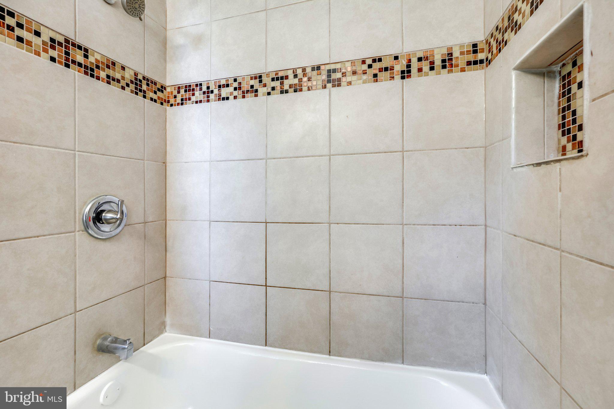7022 Deerfield Road Pikesville, MD 21208 - Photo 21 of 30 Elegant tiled shower retreat.
