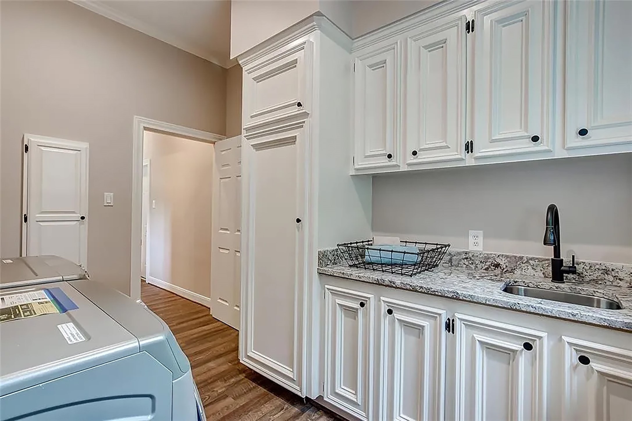 4421 Bowser Road Fulshear, TX 77441 - Photo 12 of 41 a kitchen with a sink and cabinets