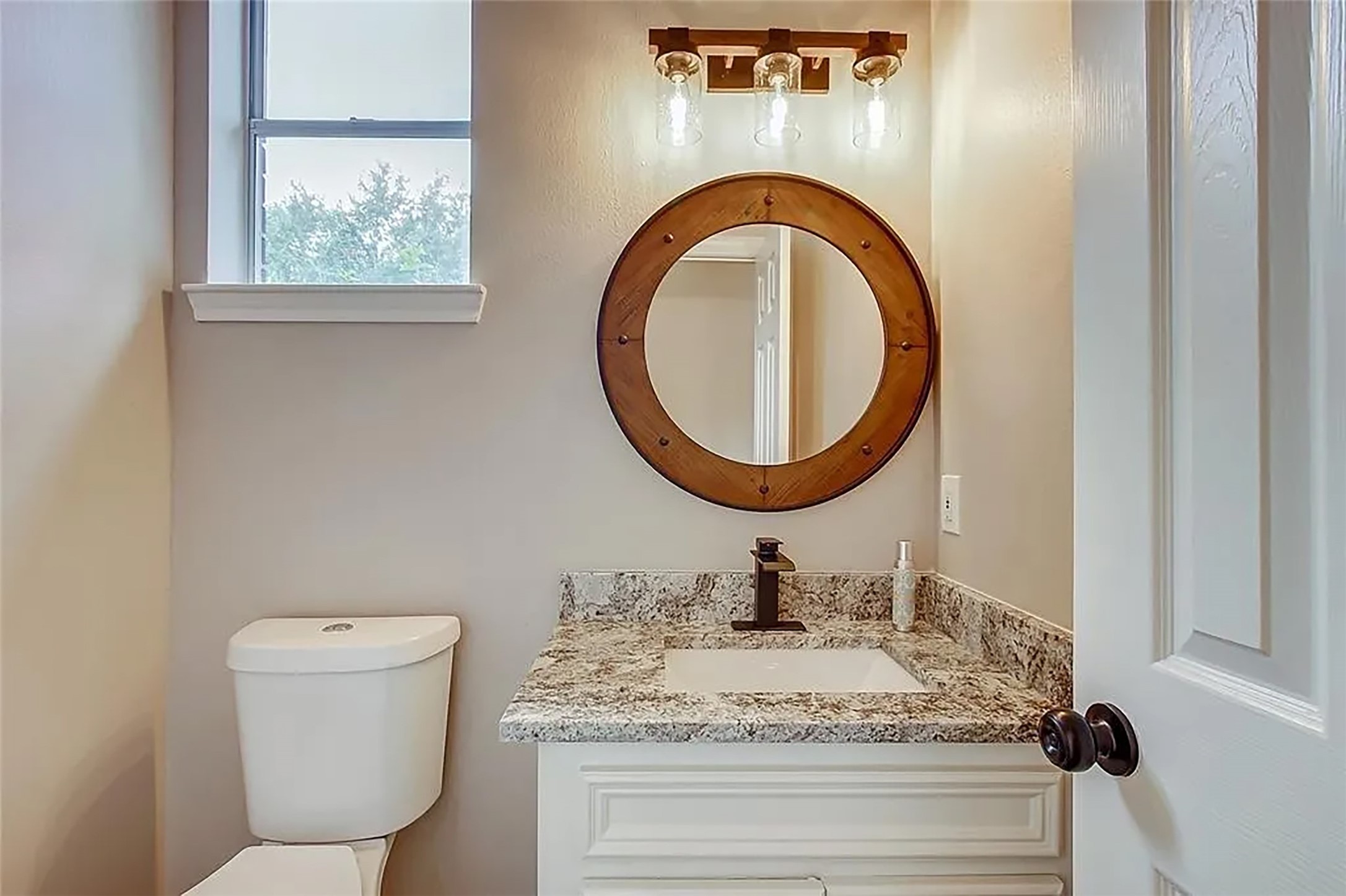4421 Bowser Road Fulshear, TX 77441 - Photo 14 of 41 a bathroom with a toilet and a sink