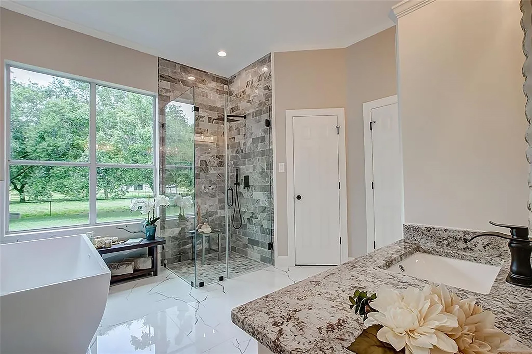 4421 Bowser Road Fulshear, TX 77441 - Photo 15 of 41 a bedroom with a bed and a large window