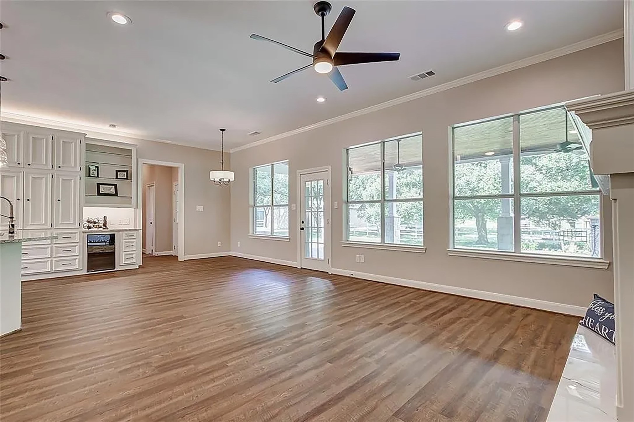 4421 Bowser Road Fulshear, TX 77441 - Photo 25 of 41 a view of an empty room with a window and wooden floor