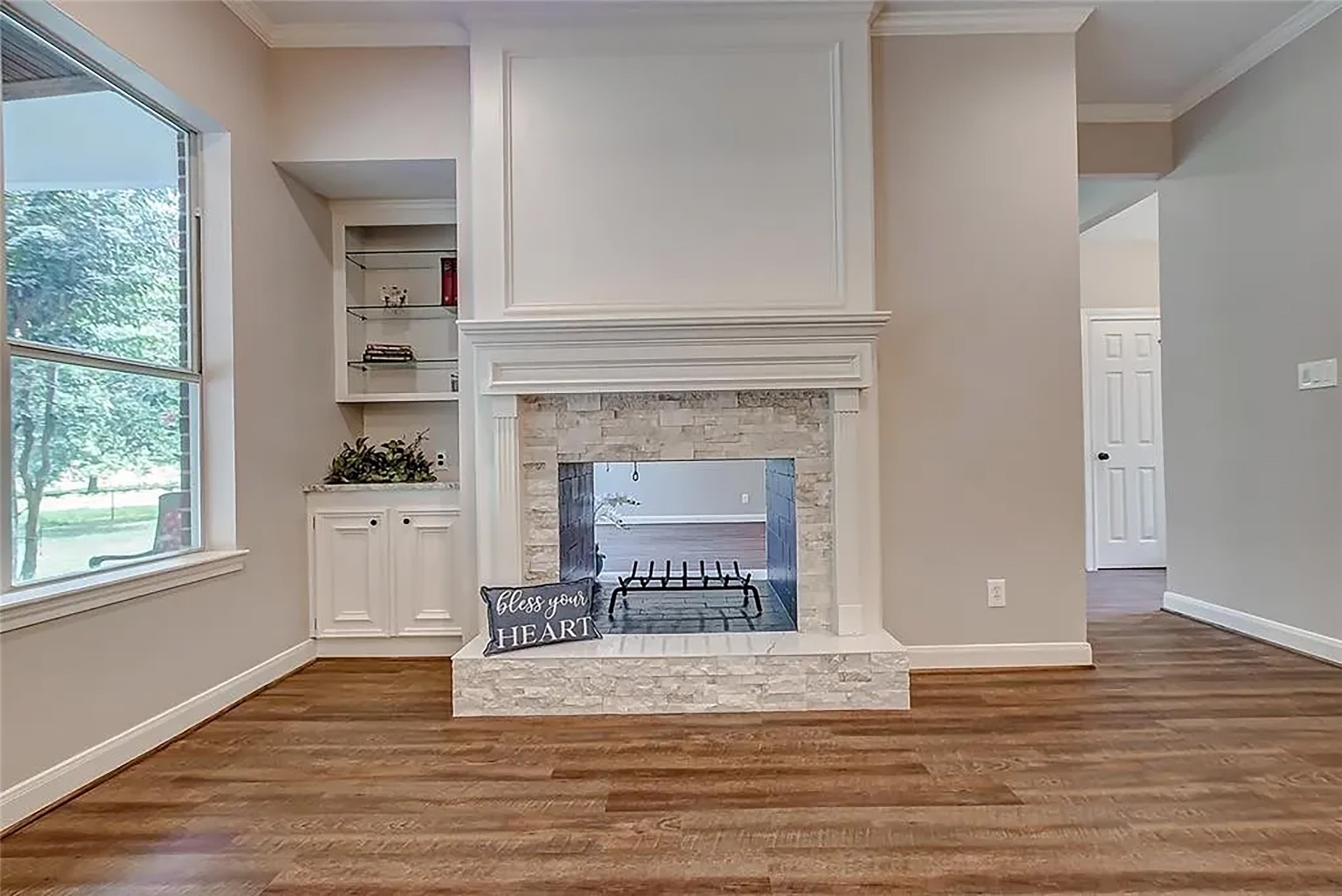 4421 Bowser Road Fulshear, TX 77441 - Photo 26 of 41 a view of a livingroom with a fireplace and window