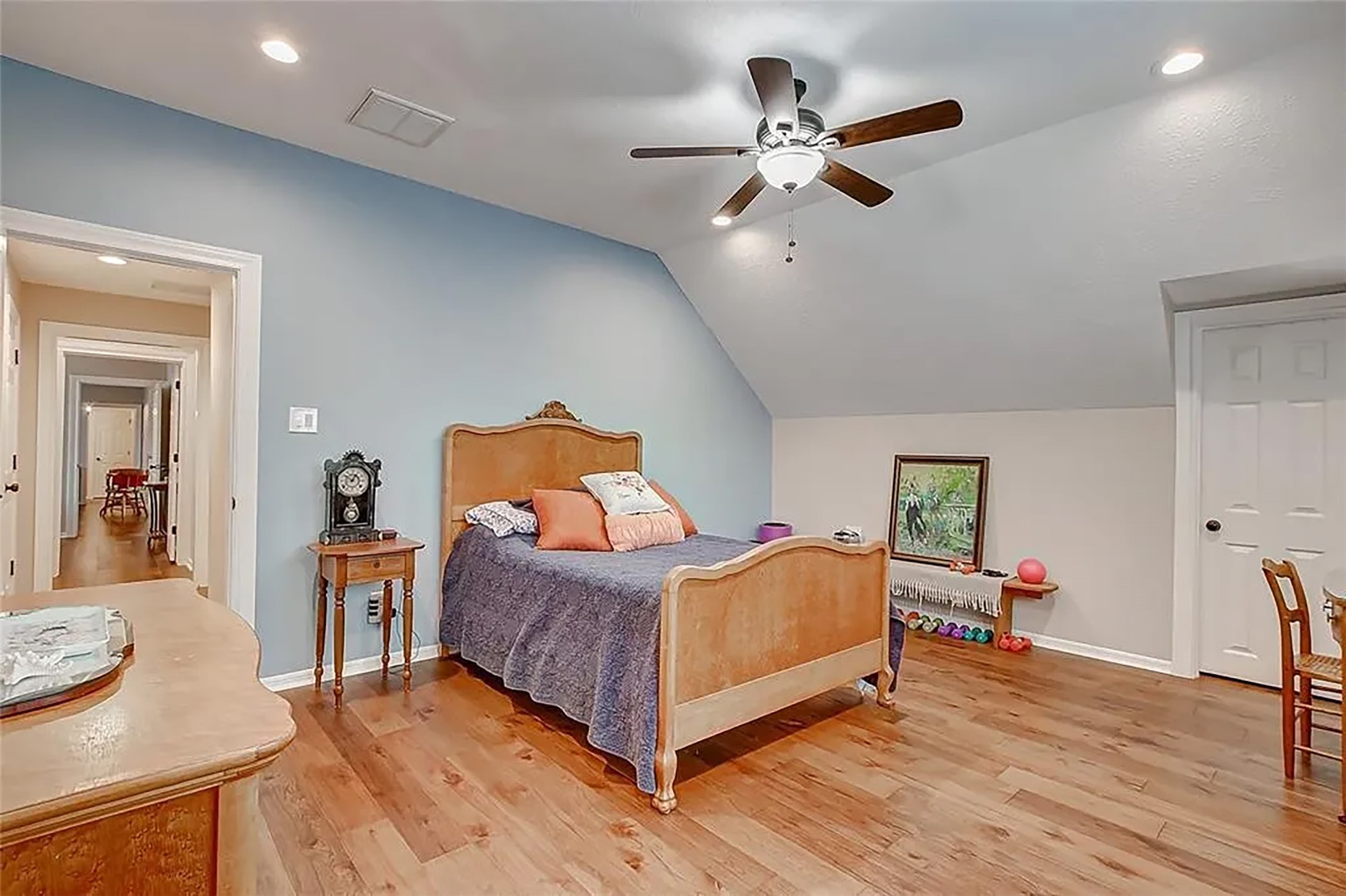4421 Bowser Road Fulshear, TX 77441 - Photo 29 of 41 a bedroom with a bed and wooden floor