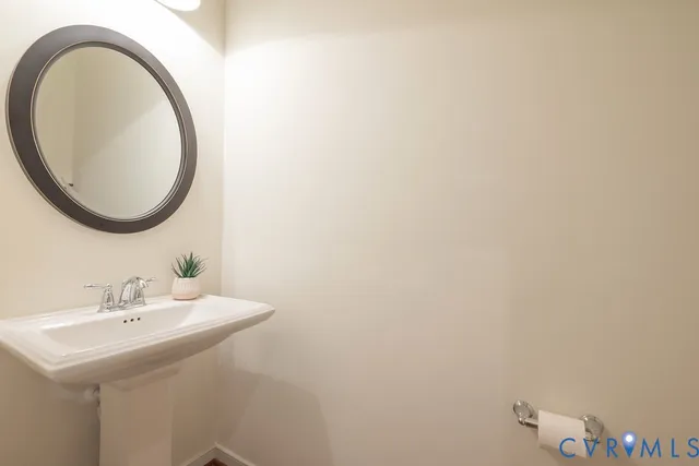 a view of room with wooden floor and cabinet