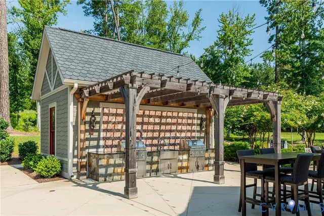 a view of a chair and table in the garden