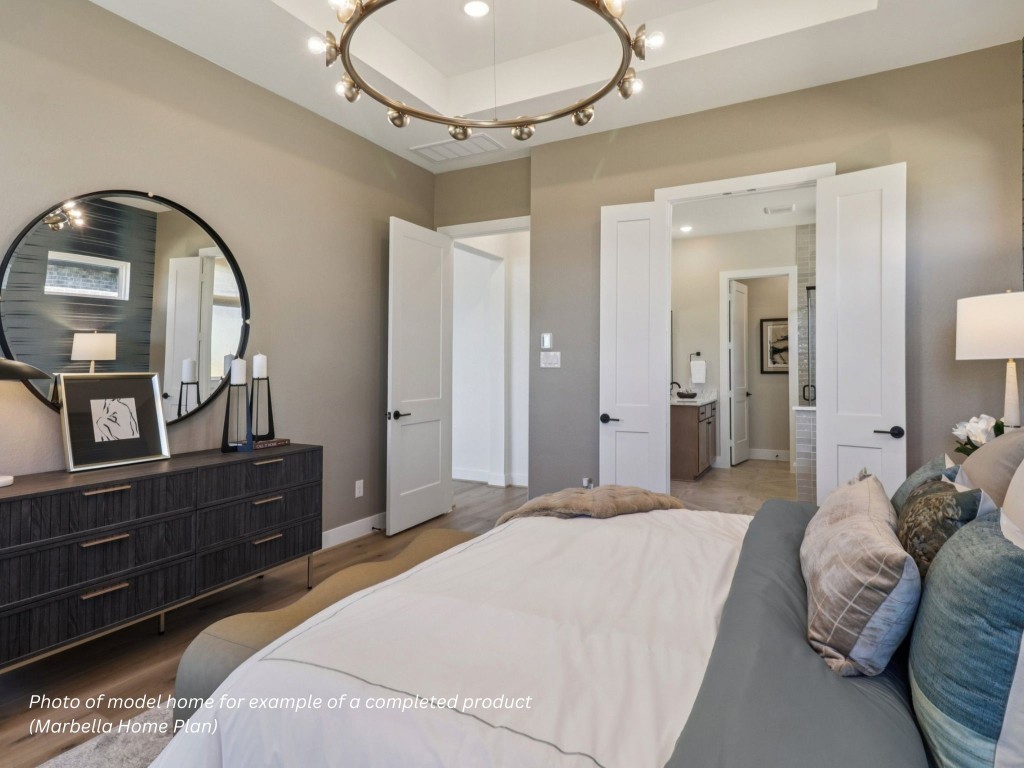 16852 Deep Wingbeat Way Magnolia, TX 77354 - Photo 5 of 12 a bedroom with a bed and a mirror on dresser