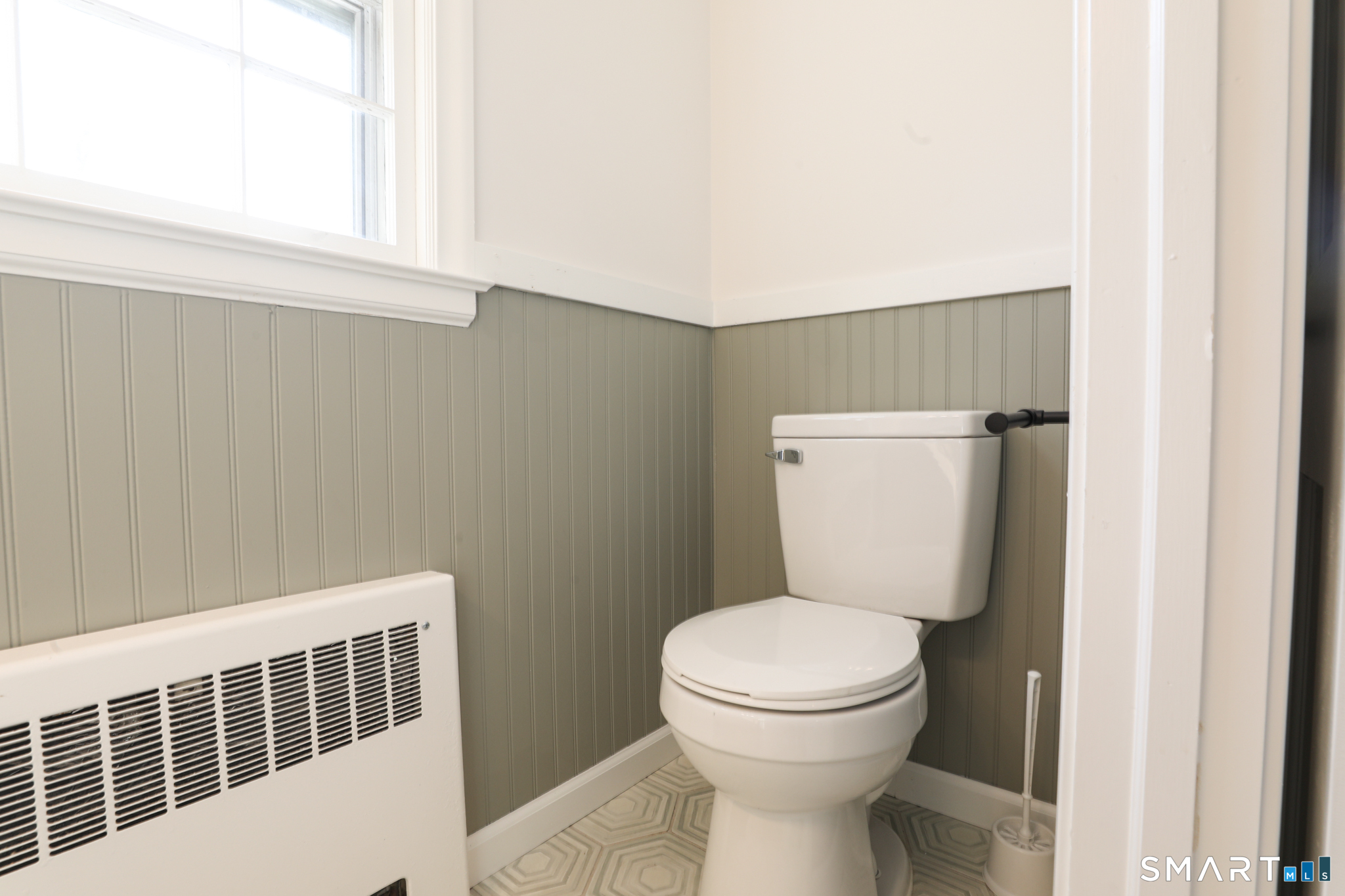 105 Hyde Road West Hartford, CT 06117 - Photo 18 of 25 a bathroom with a toilet and a sink