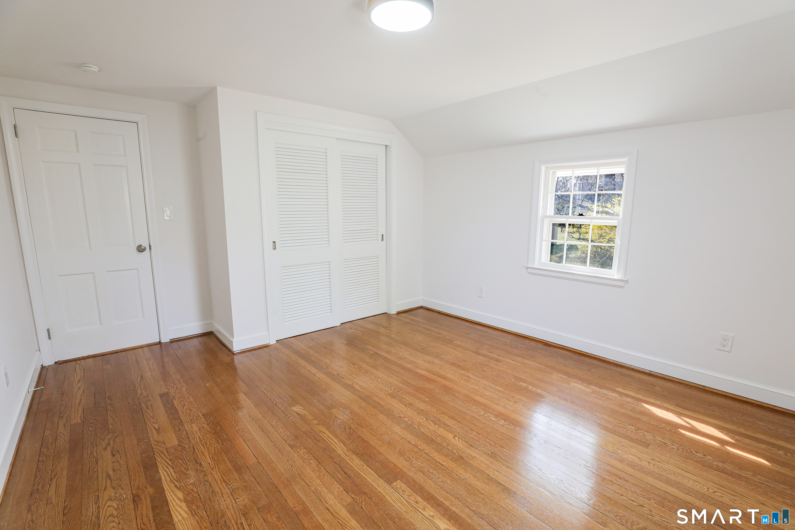 105 Hyde Road West Hartford, CT 06117 - Photo 19 of 25 a view of an empty room and window