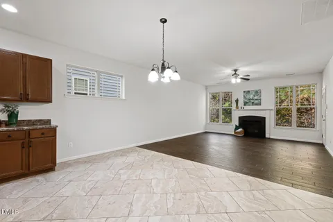 a view of livingroom and kitchen with fireplace