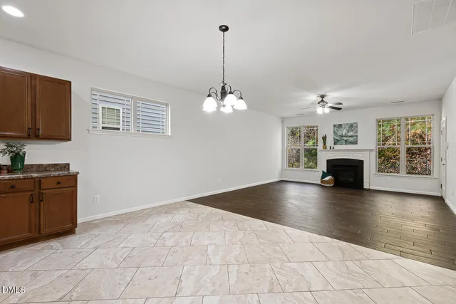 a view of livingroom and kitchen with fireplace