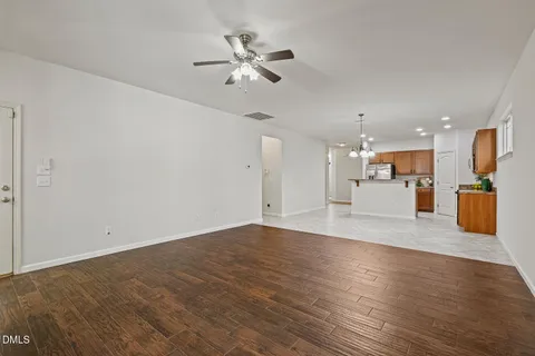 a view of a kitchen with a sink and a refrigerator