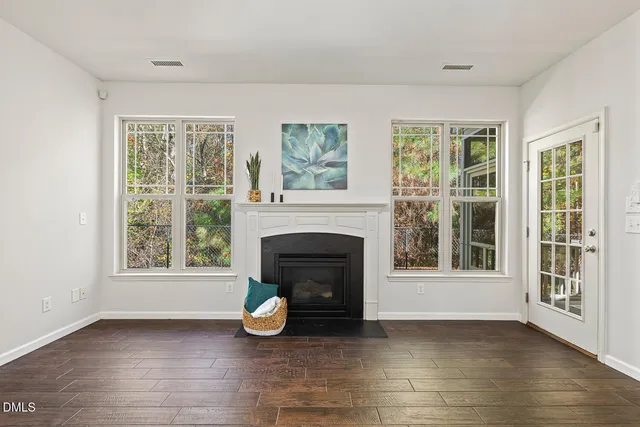 a view of a livingroom with furniture and a fireplace