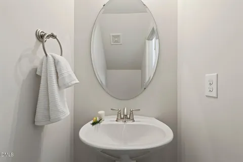 a bathroom with a sink and mirror