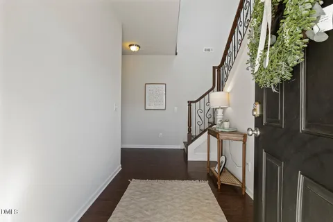a view of stairs and wooden floor