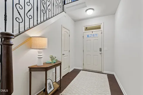 a view of hallway with wooden floor