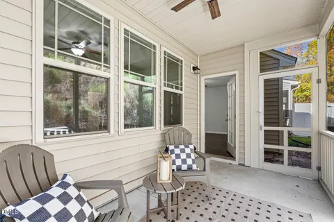 a view of a chair and table in the balcony