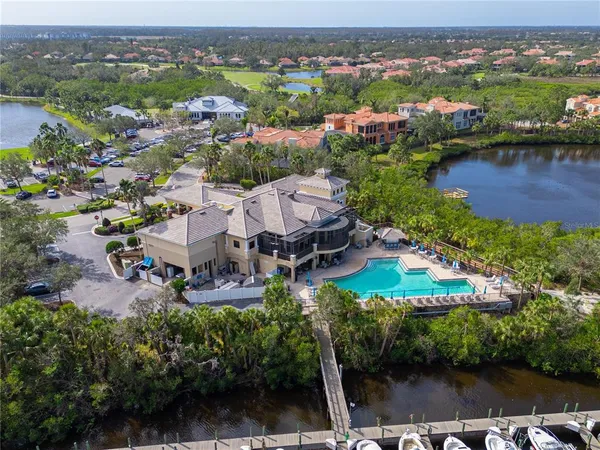 an aerial view of a house with a lake view