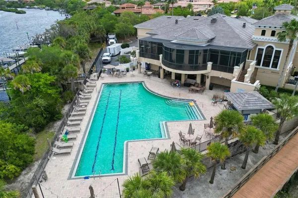 an aerial view of a house with a big yard