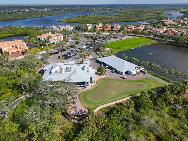 an aerial view of a house with a lake view