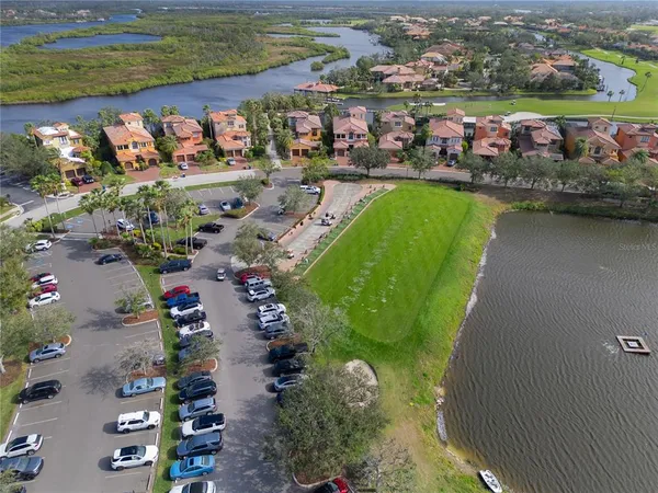 an aerial view of a house with a lake view