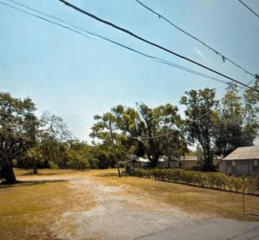 a view of a swimming pool with an outdoor space and seating area