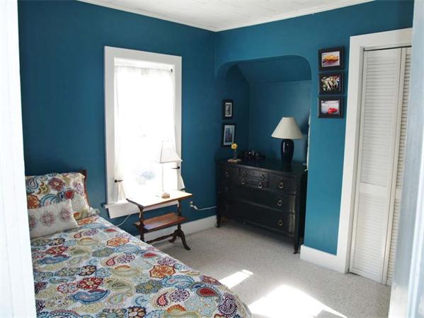 31 Bridge Road Northampton, MA 01062 - Photo 15 of 20 a bedroom with a bed and a dresser in it