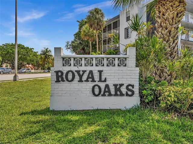 a view of a hallway view with wooden floor and living room